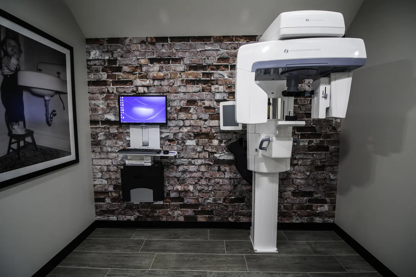 The digital panoramic imaging unit against the brick wall.