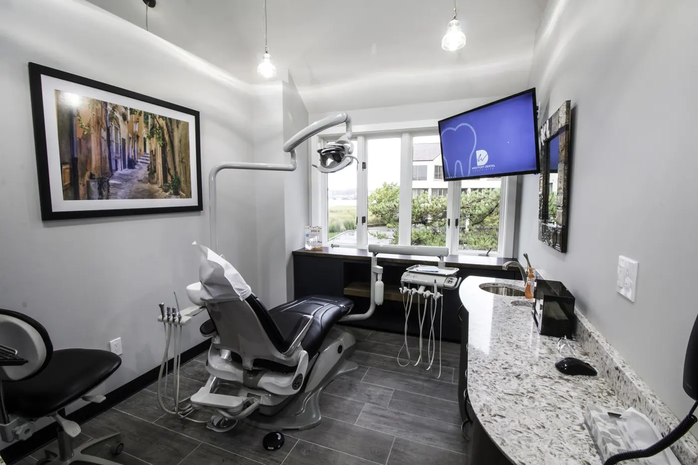 A treatment room with a window looking onto the river.