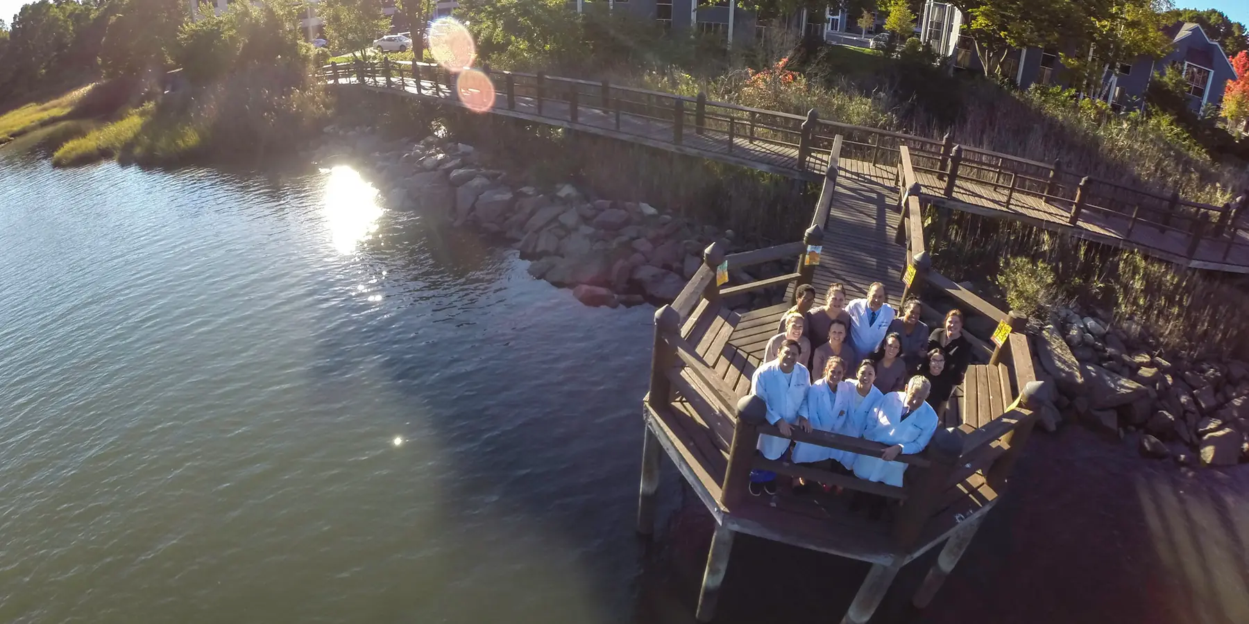 The Westport Dental Associates team on the dock behind the practice, over the Saugatuck River.