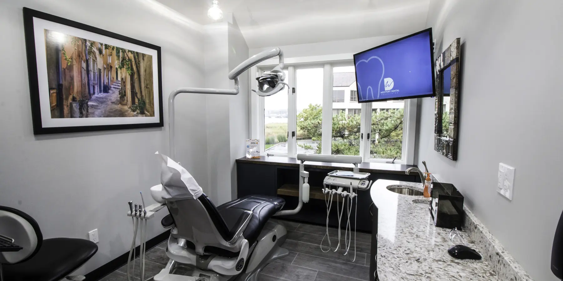 A treatment room at Westport Dental Associates, looking onto the Saugatuck River.