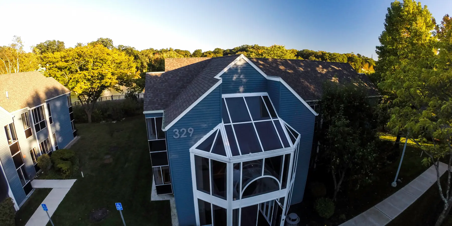 329 Riverside Avenue from the air, the bay window of the practice at golden hour.